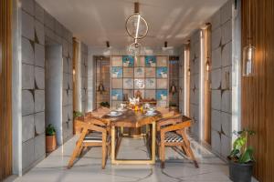 SaffronStays Nautica - 5BR hilltop villa with rooftop pool, sea views & modern interiors surrounded by greenery