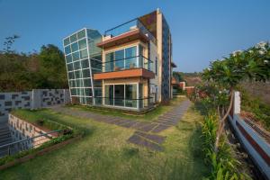 SaffronStays Nautica - 5BR hilltop villa with rooftop pool, sea views & modern interiors surrounded by greenery