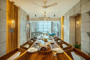 SaffronStays Nautica - 5BR hilltop villa with rooftop pool, sea views & modern interiors surrounded by greenery