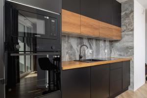 Elegant Apartment with Parking near Tauron Arena Kraków by Noclegi Renters