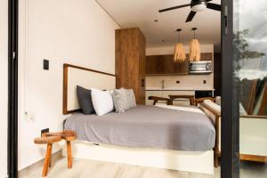 Chaac Apartment - Modern 1BR Studio with Balcony, Pool & Gym Access by Luwii Stays