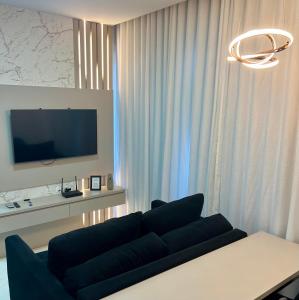 Ap completo a 900m da Oktoberfest com Piscina, academia, Wi-Fi, ar, garagem e tv no quarto