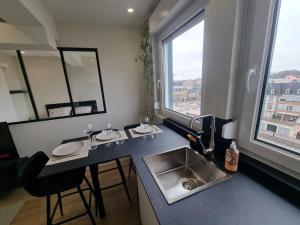 Appartements Sur la savoureuse - Le 64 : photos des chambres