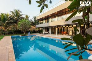 Reflection House by StayVista with Pool, Terrace bar, Indoor games & Exquisite interiors in a nutshell