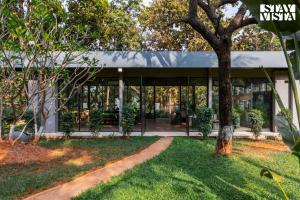 Reflection House by StayVista with Pool, Terrace bar, Indoor games & Exquisite interiors in a nutshell