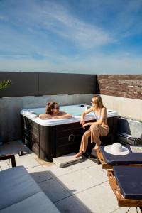 Appartements Le rooftop - jacuzzi et climatisation : photos des chambres