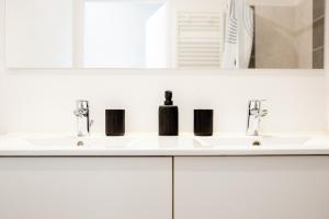 Appartements Le rooftop - jacuzzi et climatisation : photos des chambres