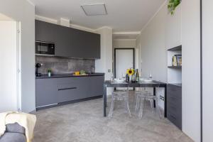 Elegant Seaside Apartment with Pool and Parking