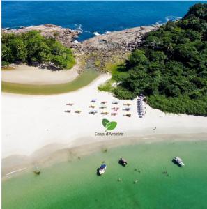 Casa dAroeira Residencial Boutique - Centro de Juqueí - Perto de Tudo - 2 quadras do Mar - Serviço de Praia - Roupa de Cama 600 fios algodão Egípcio - Tudo Novo - Estacionamento Interno - Cozinha - Consulte unidades com Ofurô Hidro e Cromoterapi