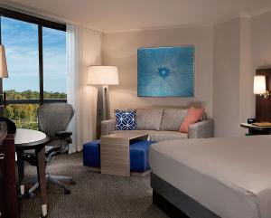 One King Bedroom with Resort View Mobility Hearing Accessible Tub room in Hilton Orlando Buena Vista Palace - Disney Springs Area