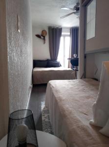 Appartements Pied a terre, sejour idyllique face a la mer classe 2 etoiles : photos des chambres