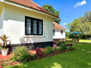 The Farmhouse, Tigoni, 1920s home, 85 acre tea farm, outdoor bath & shower