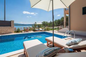 Seafront Villa Noah with heated pool