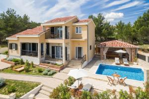 Seafront villa Noah with heated pool