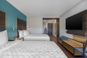 Queen Room with Two Queen Beds and Walk-In Shower room in Tru by Hilton Oshkosh