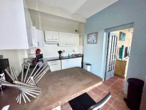 Appartements Appartement Jardin exotique : photos des chambres