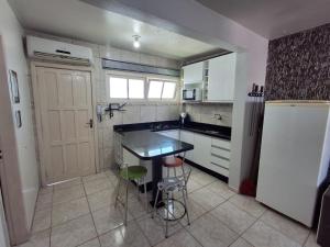 Apartamento no Centro do Arroio a 1 quadra do mar