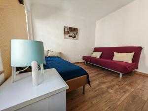 Appartements La maison aux volets bleus : photos des chambres