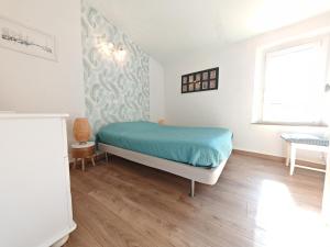 Appartements La maison aux volets bleus : photos des chambres