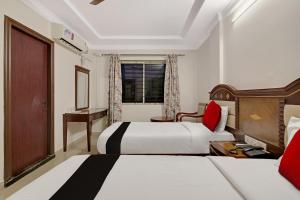 Capital O Elegant Amethyst Business Hotel Near Ragigudda Sri Prasanna Anjaneyaswamy Temple
