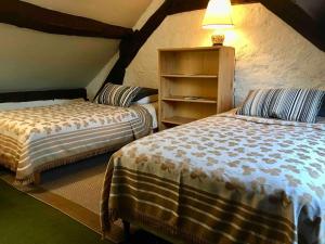 Maisons de vacances Maison de village avec grand jardin : photos des chambres