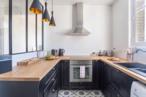 Appartements GuestReady - Designer Apartment - Eiffel Tower View! : photos des chambres