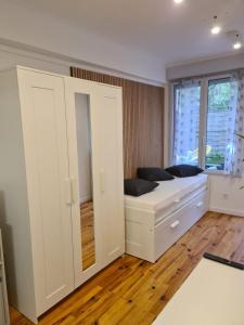 Appartements Studio cosy avec clim et jardin : photos des chambres