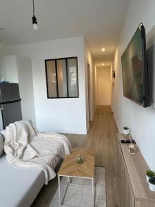 Appartements 2P cosy aux portes de Paris : photos des chambres