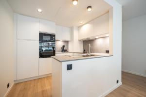 Luxe comfort app met zijdelings zeezicht en in centrum