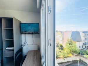 Appartements STUDIO A 300 METRES DE LA GARE et 25 MINUTES DE PARIS EN TRAIN : photos des chambres