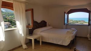 Villa Anna - Mansarda vista mare con giardino e patio