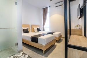 Phòng Hai Giường Đơn Loại Sang (Deluxe Twin Room)