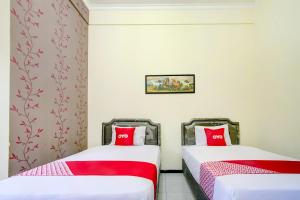 Capital O 90151 Guest House 180