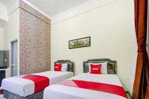 Capital O 90151 Guest House 180