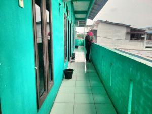 SPOT ON 92839 Nany Asoka Syariah Near Anyong Cafe Studio