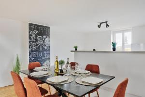 Appartements Le Nid Caladois - Centre-ville : photos des chambres