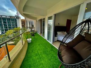 newly furnished two bedroom apartment with swimming pool, fully equipped gym, private parking space,children playground and unbeatable scenic city views