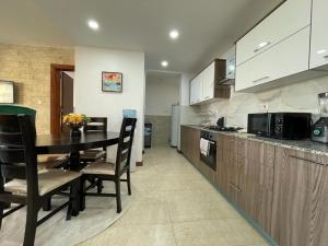 newly furnished two bedroom apartment with swimming pool, fully equipped gym, private parking space,children playground and unbeatable scenic city views