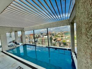 newly furnished two bedroom apartment with swimming pool, fully equipped gym, private parking space,children playground and unbeatable scenic city views