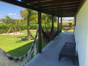 Nossa casa com muito verde no Rosa