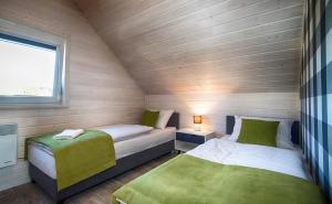 FLAUTA Całoroczne domki z prywatną balią, sauną i jacuzzi