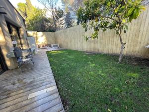 Glass and wood designer villa with garden in centertown