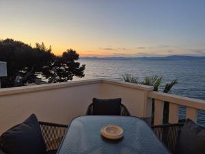 APARTMENTS BRUNO 1&2 - two-room penthouse apartments - wonderful panoramic view of the sea - the best location, first row to the beach - 10 minutes from Supetar ferry port - free secured parking - facilities nearby