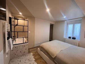 Appartements ESCAPADE Sereine - Studio Balneo a Laval : photos des chambres