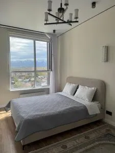 Двухкомнатная студия с панорамным видом на горы - Qurylysshy