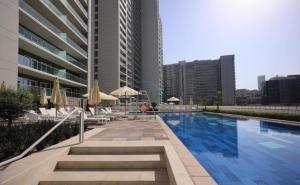 Promo Stylish 1BR City Living at Reva Residences by Deluxe Holiday Homes