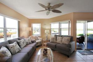 Watch dolphins from your lanai in this bayfront Siesta Key condo