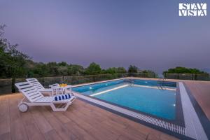 StayVista at The Windchime with Pool & Gazebo