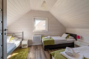 FLAUTA Całoroczne domki z prywatną balią, sauną i jacuzzi