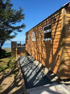 coastal view shepherds hut with hot tub